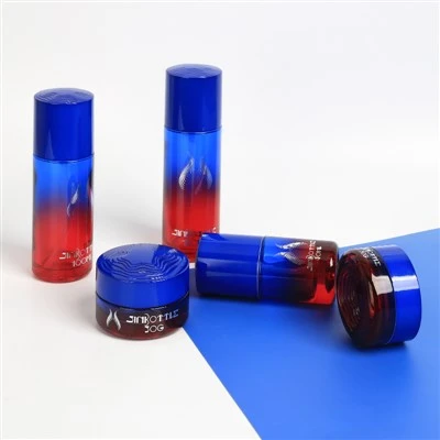 Maßgeschneidertes Luxus-Kosmetikverpackungsset aus blauem und rotem Glas mit Lotionsflasche und Cremetiegel für hochwertige Hautpflegemarken